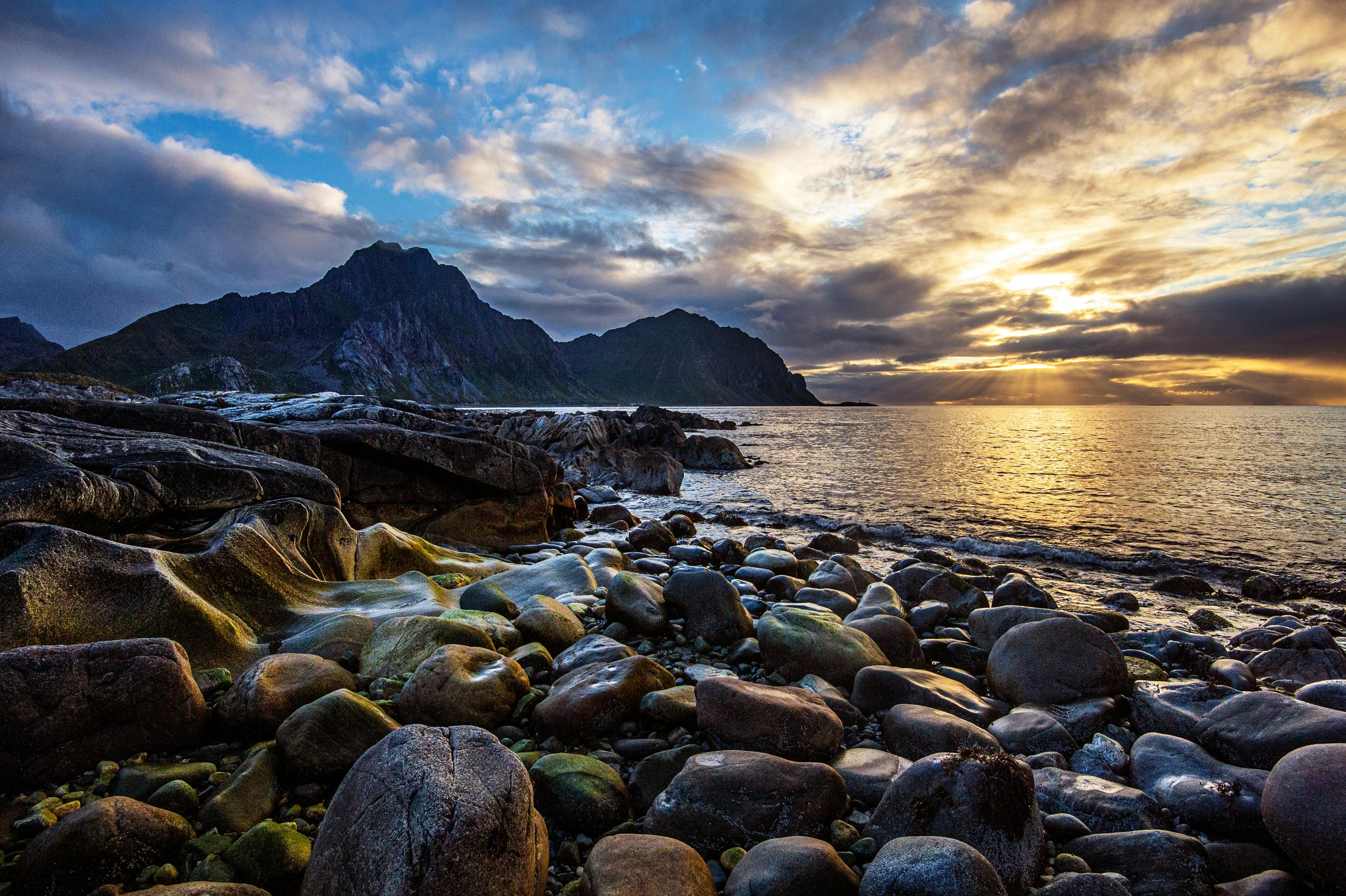 Midnight sun over a beach in Lofoten during summer
